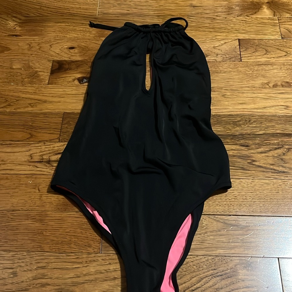 Pink one piece black bathing suit